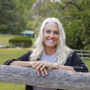 Woman leaning on fence