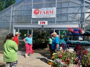 farm tour in front of greenhouse at Cape Abilities Farm