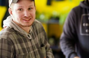 Man in hat smiling at camera